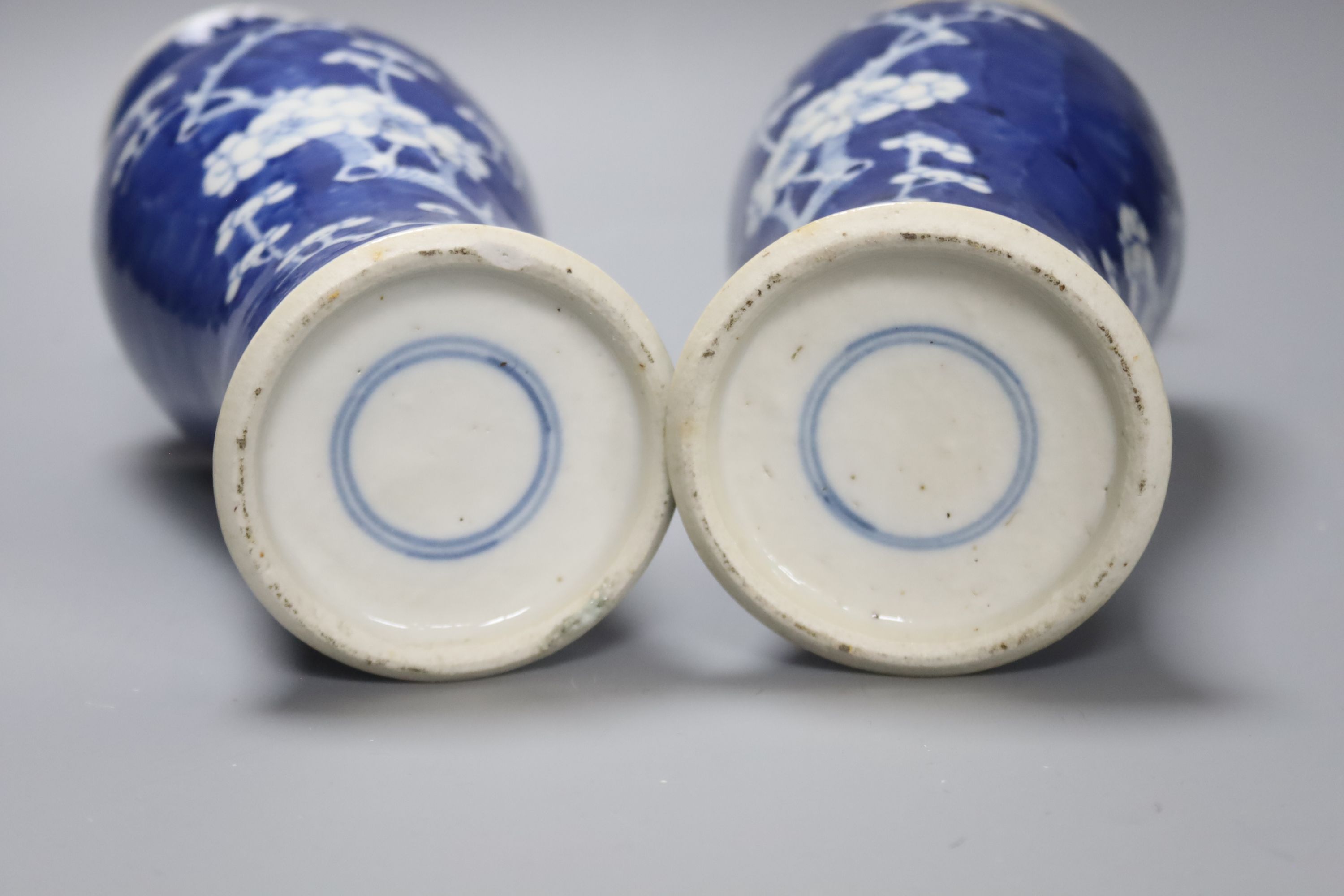 A pair of slender Chinese blue and white prunus vases, late 19th century, height 30cm